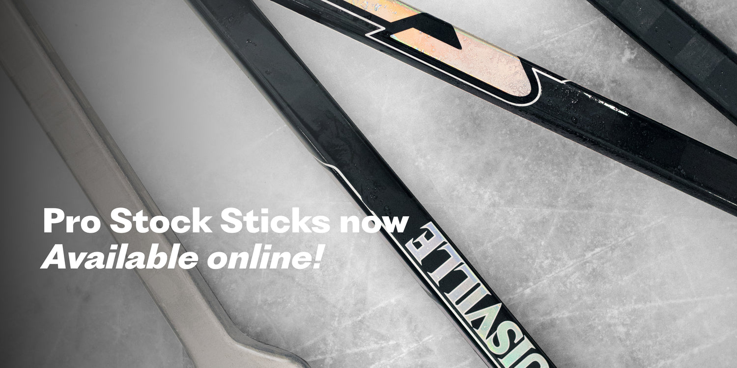 Hockey sticks on a textured surface with text 'Pro Stock Sticks now Available online!'.